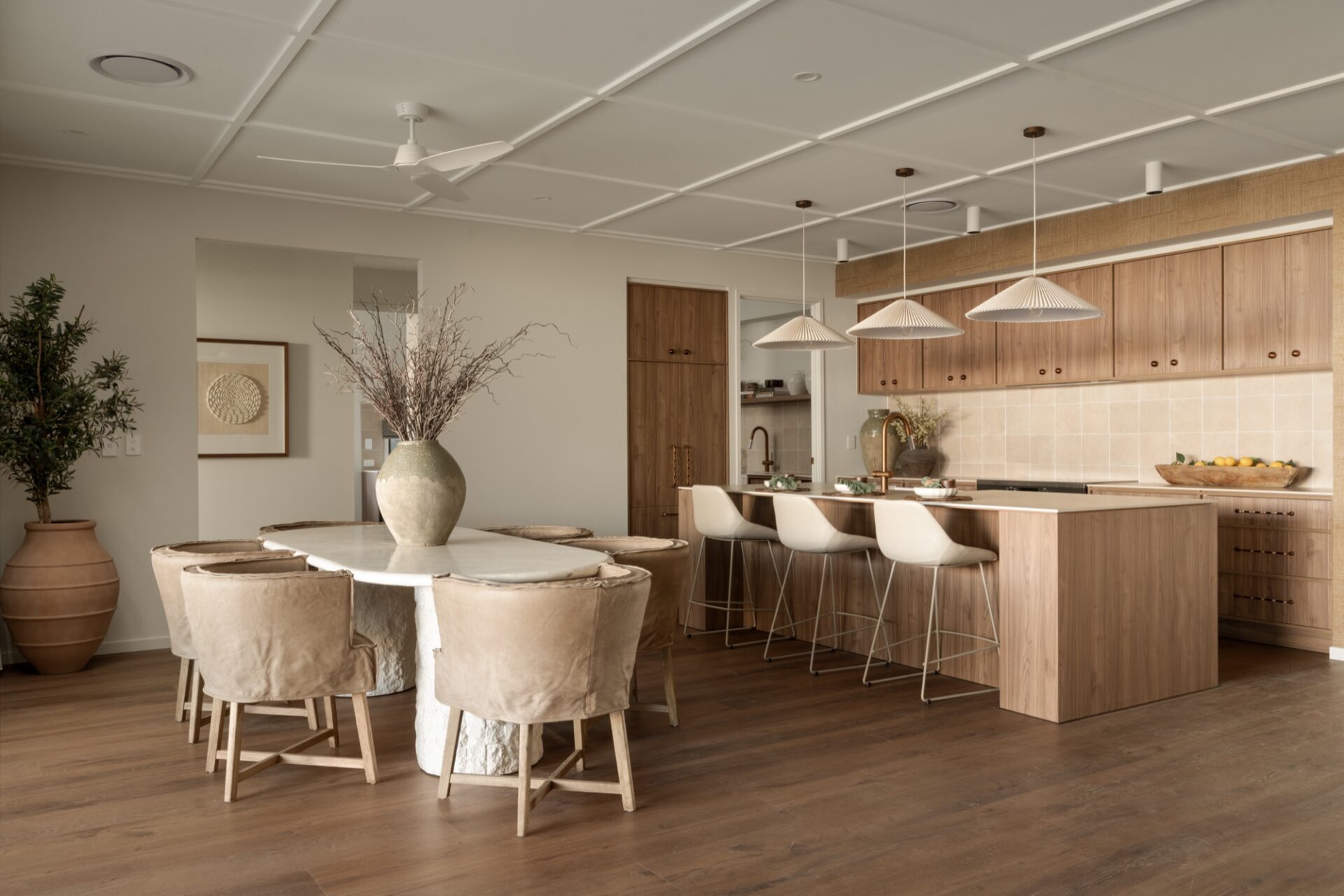 Bold Living open plan kitchen and dining with timber cabinetry and stone island bench