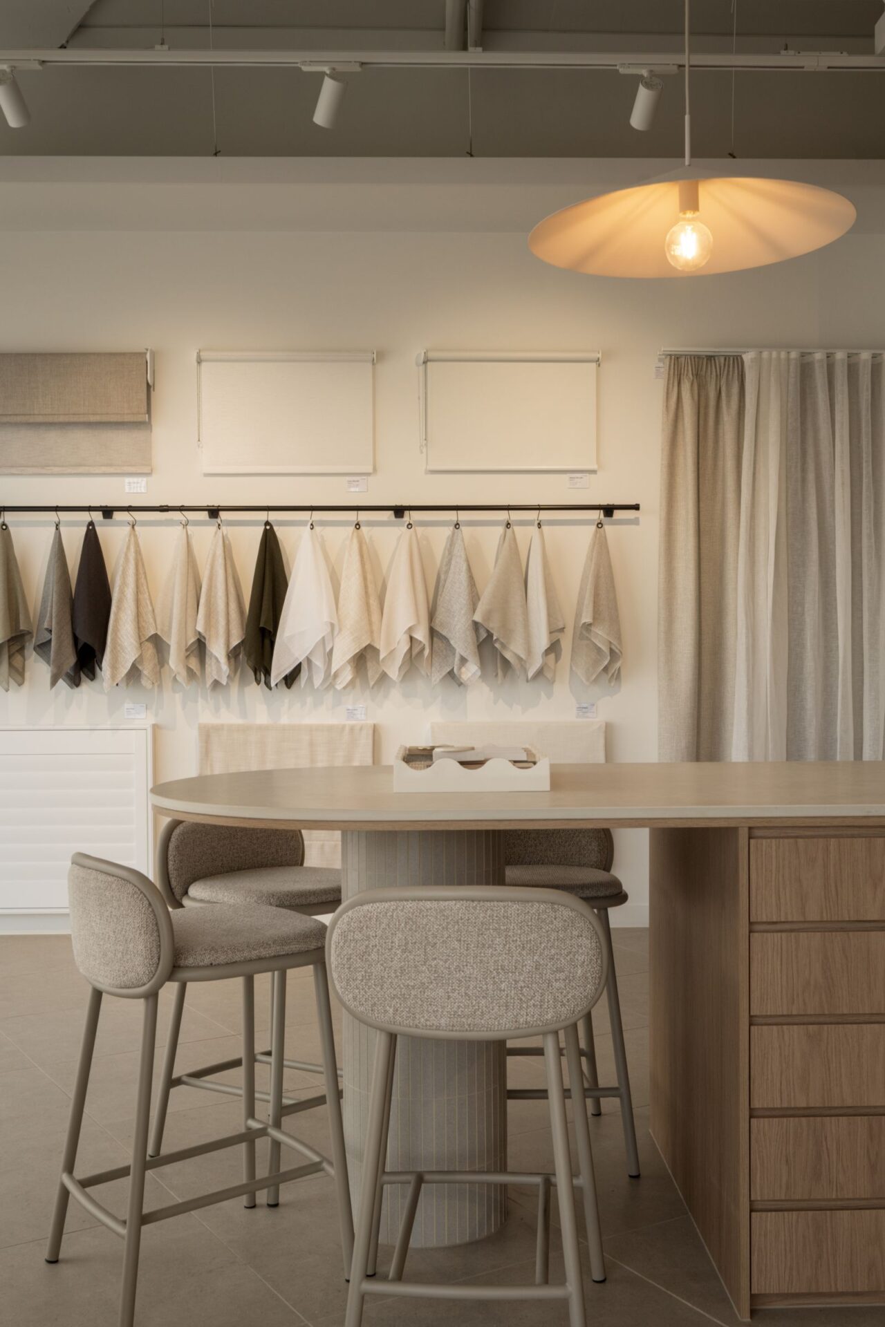 Consultation table with curtain fabric samples hanging behind
