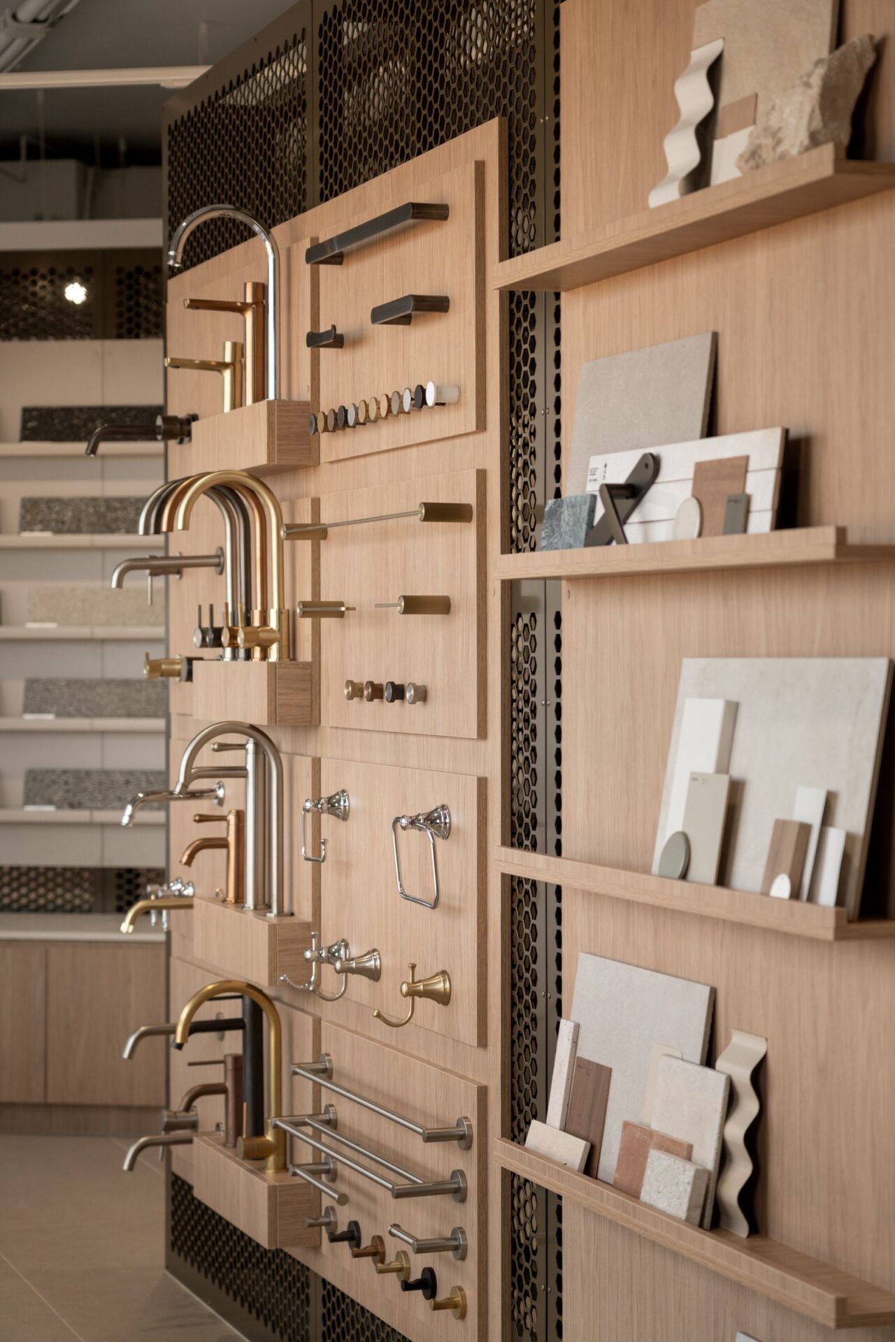 Tapware and handles mounted on a timber display wall